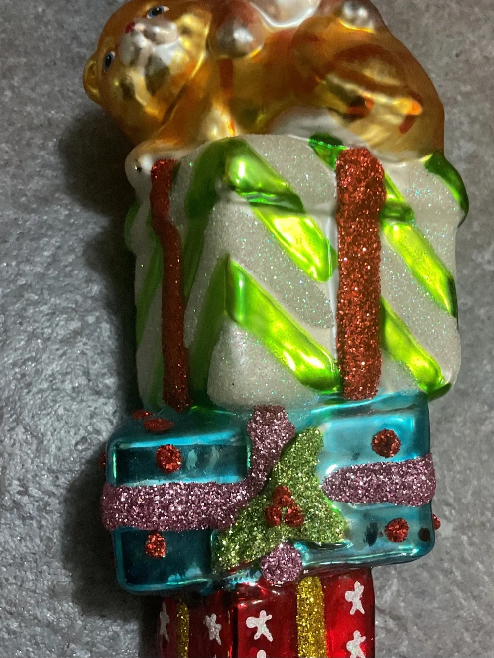 Glass Dog Ornament Sitting on Stacked Presents - Brown, Gold, Green